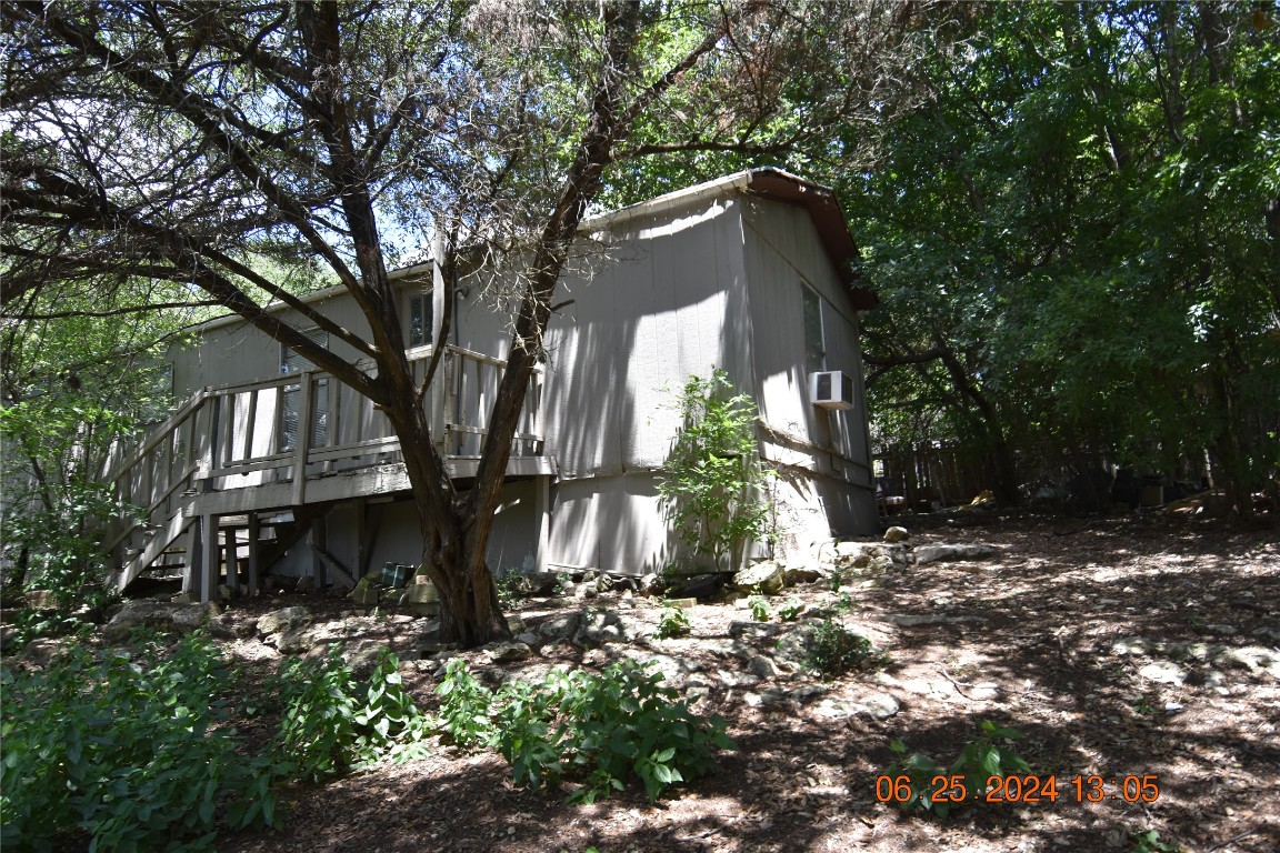 a view of a house with a tree