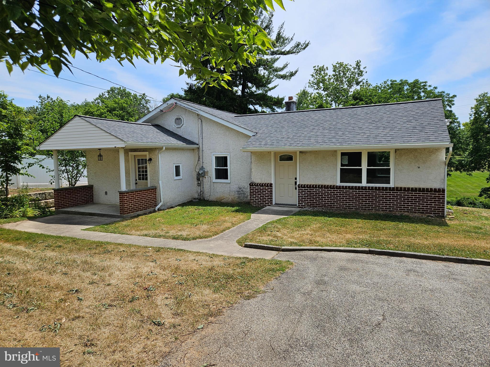 a house with trees in the background