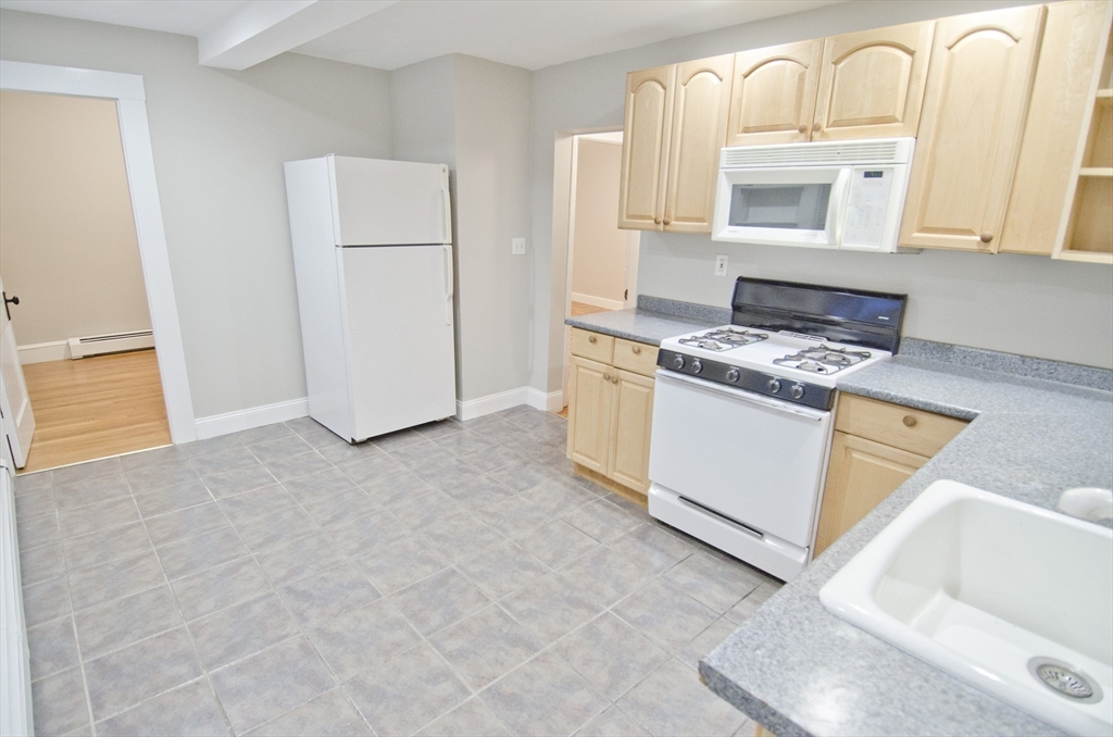 a kitchen with a stove and a microwave