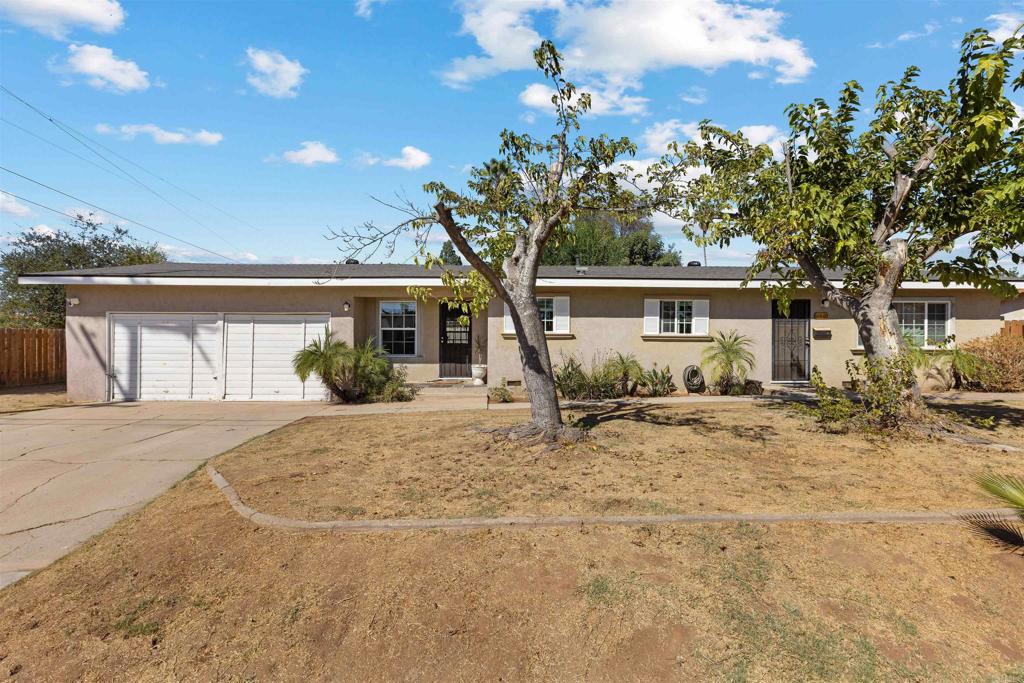 a house with trees in the background