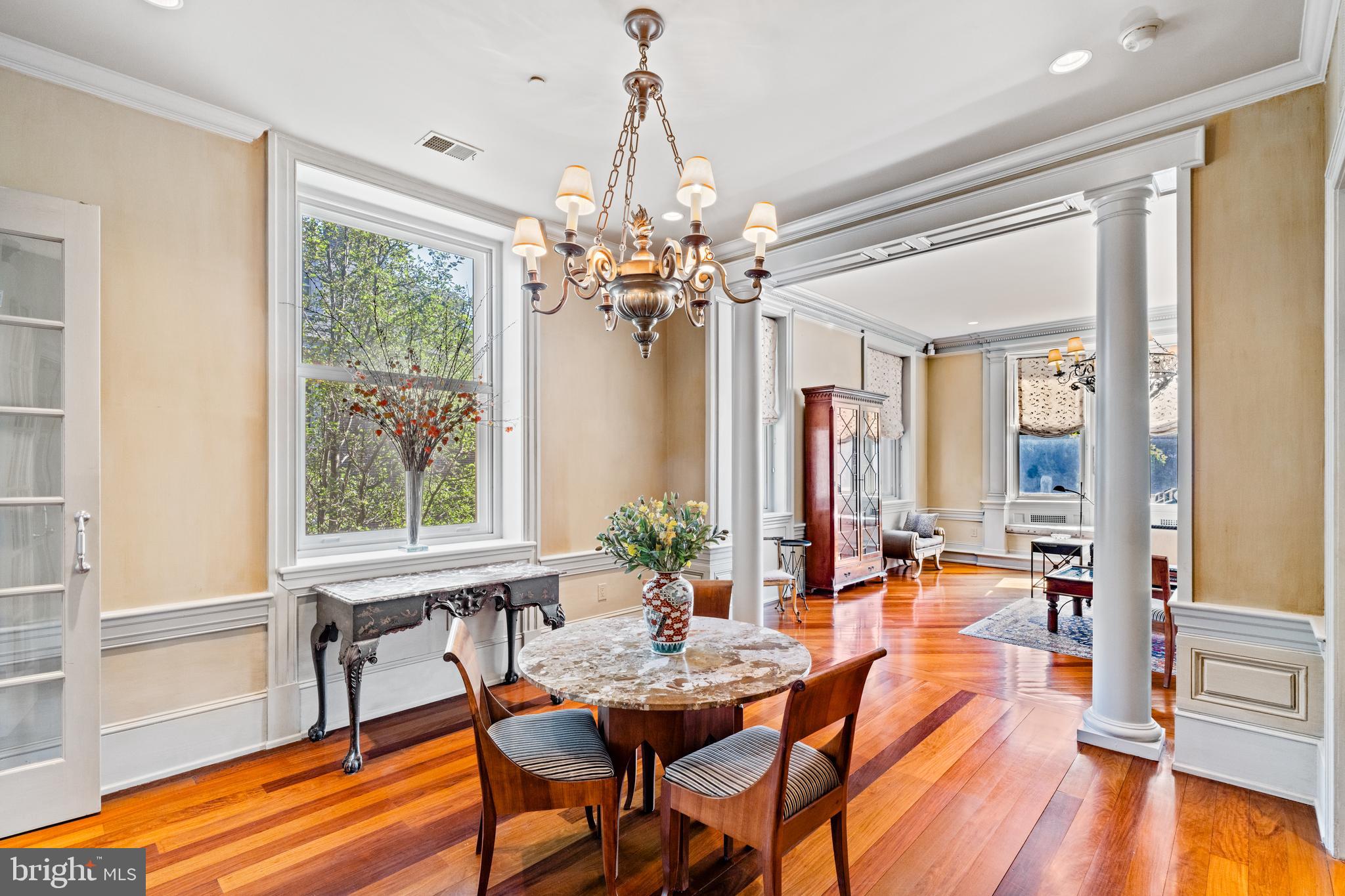 a view of a dining room with furniture window and wooden floor