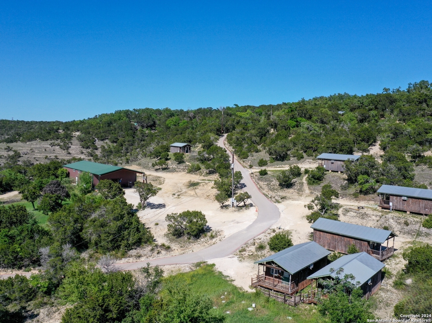 an aerial view of a house with mountain view