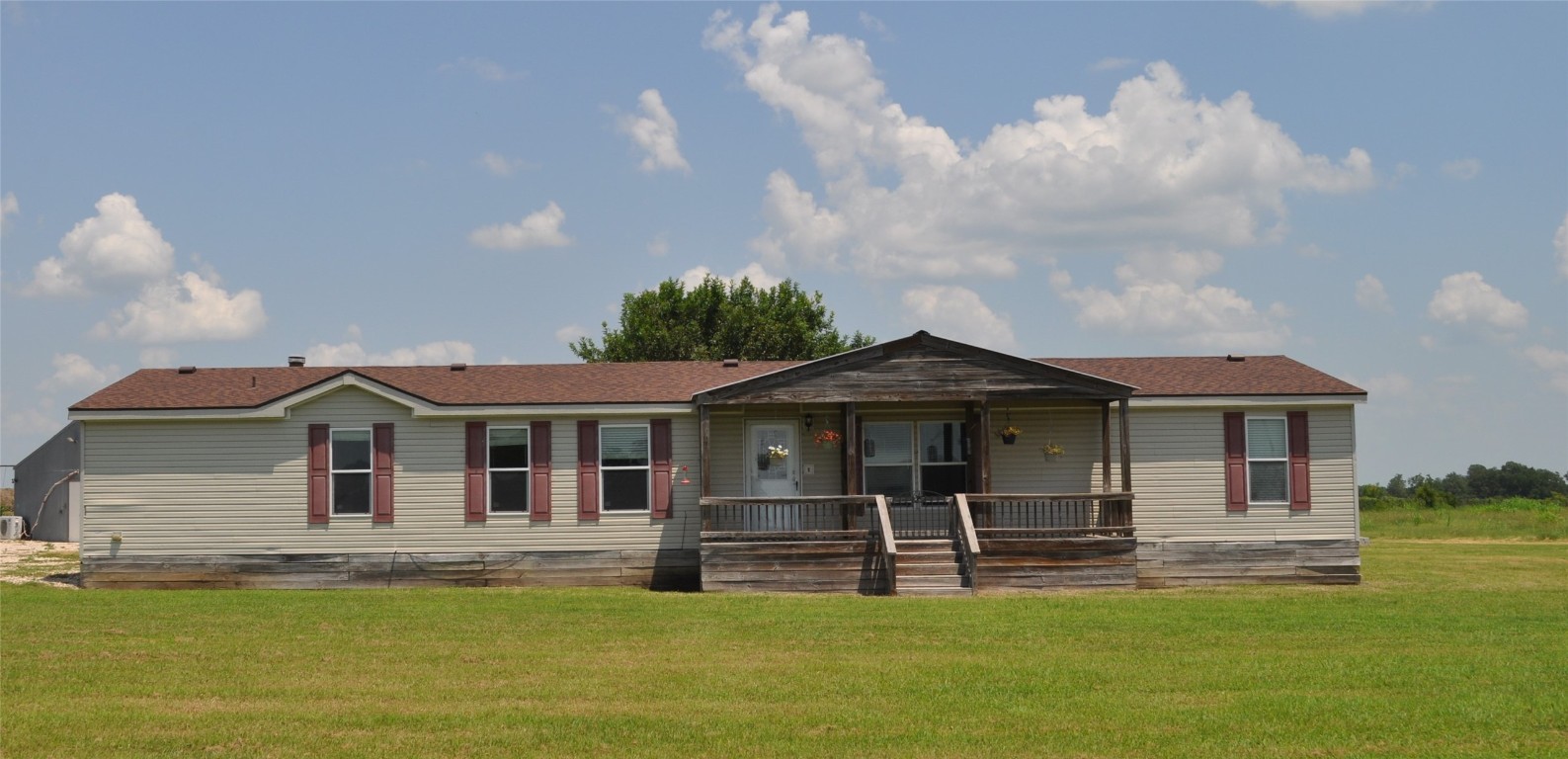 a front view of a house with a yard table and chairs