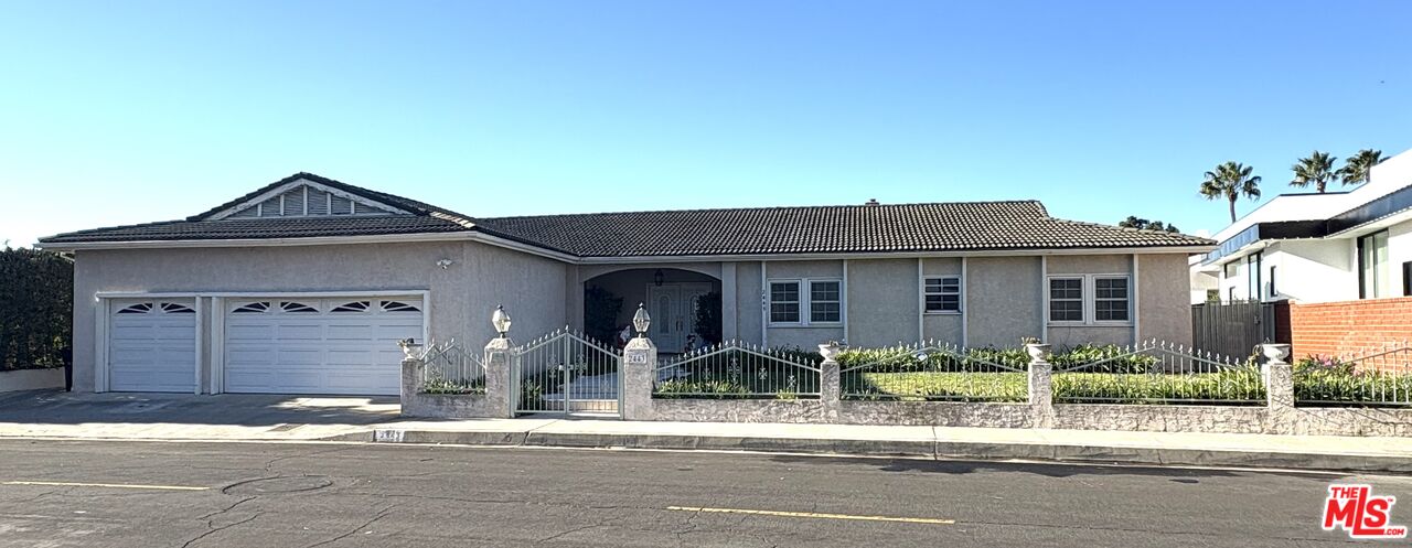 front view of a house with a small yard