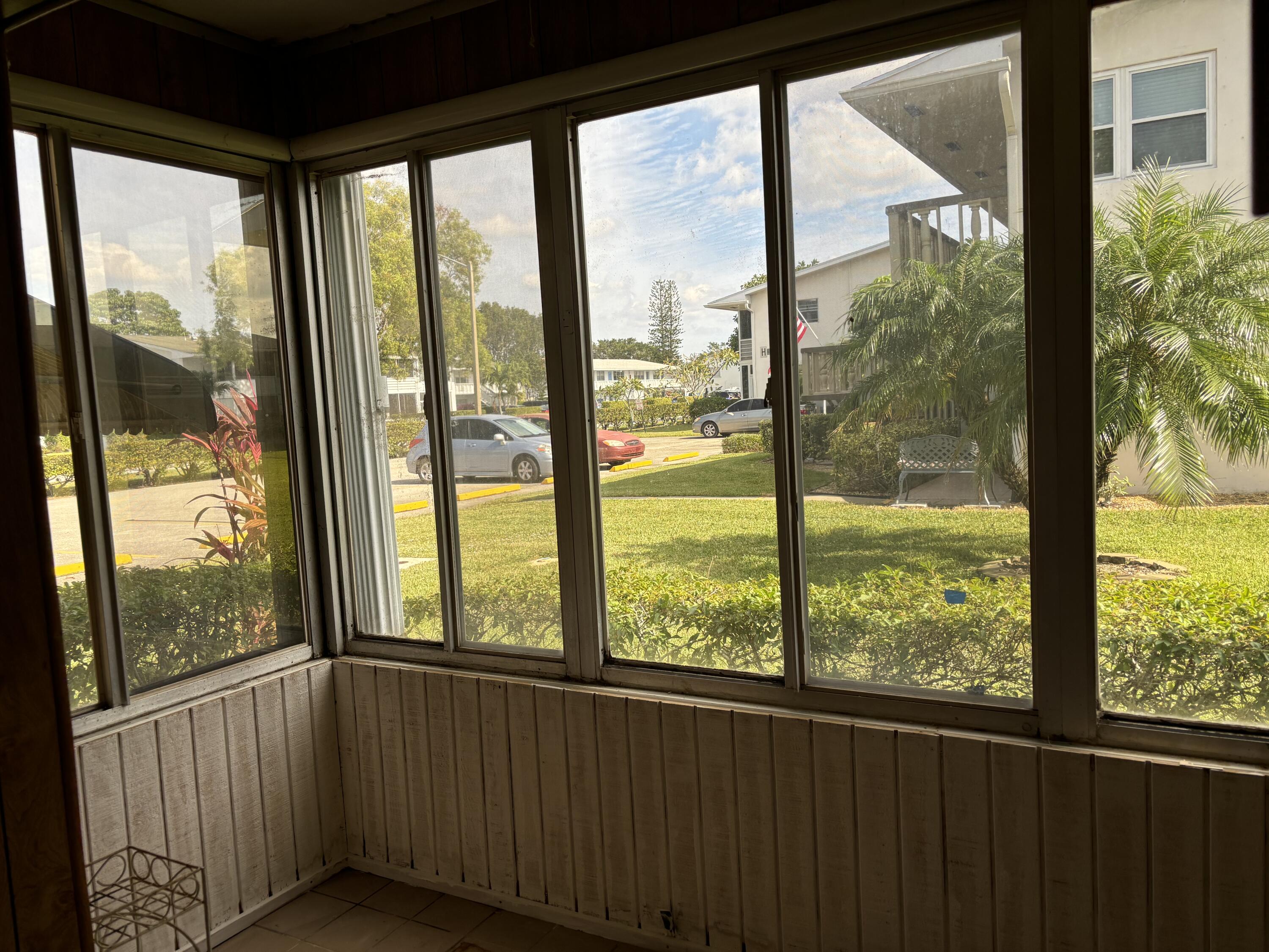 a view of an empty room with a large window