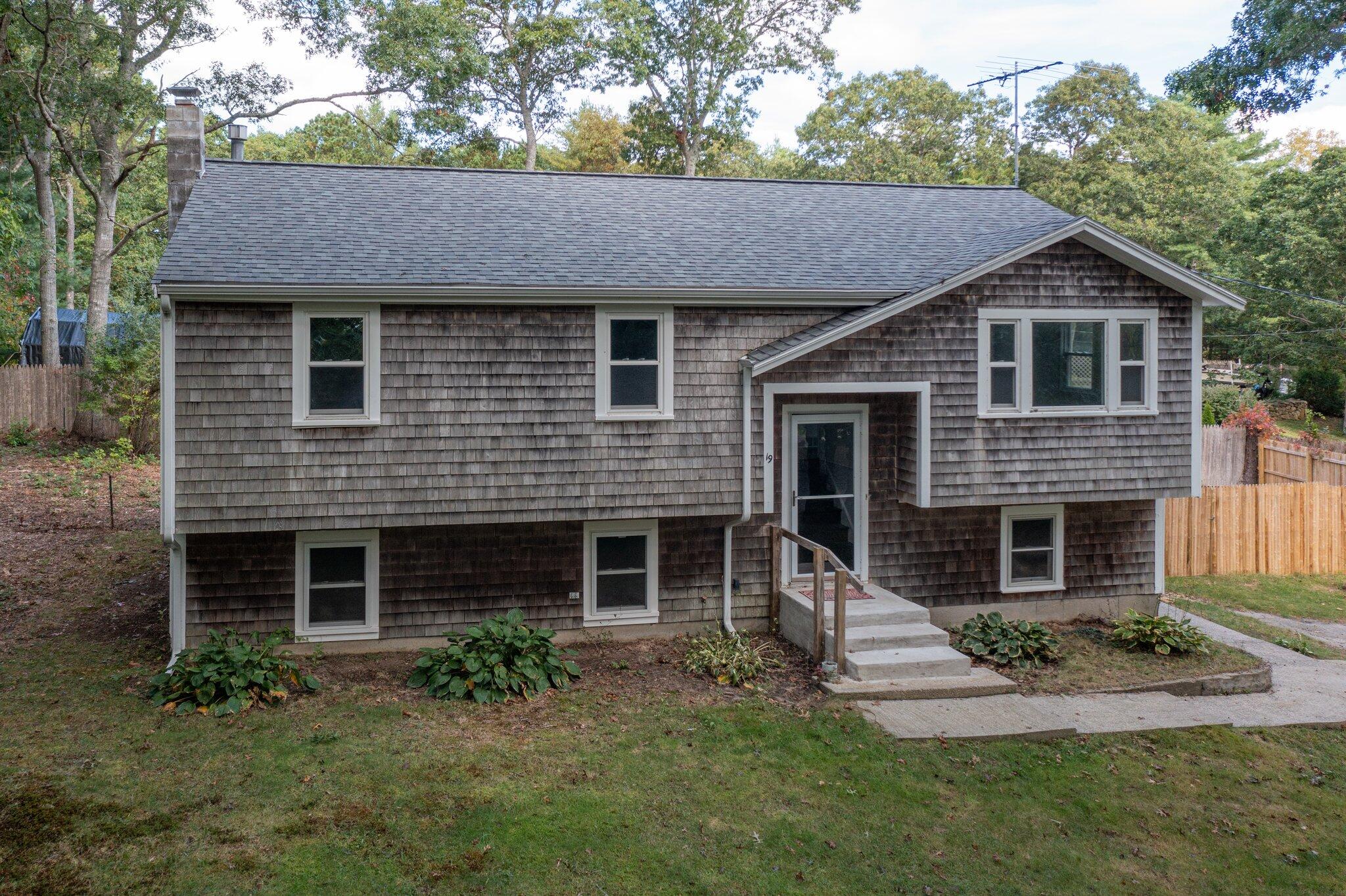 a front view of a house with a yard