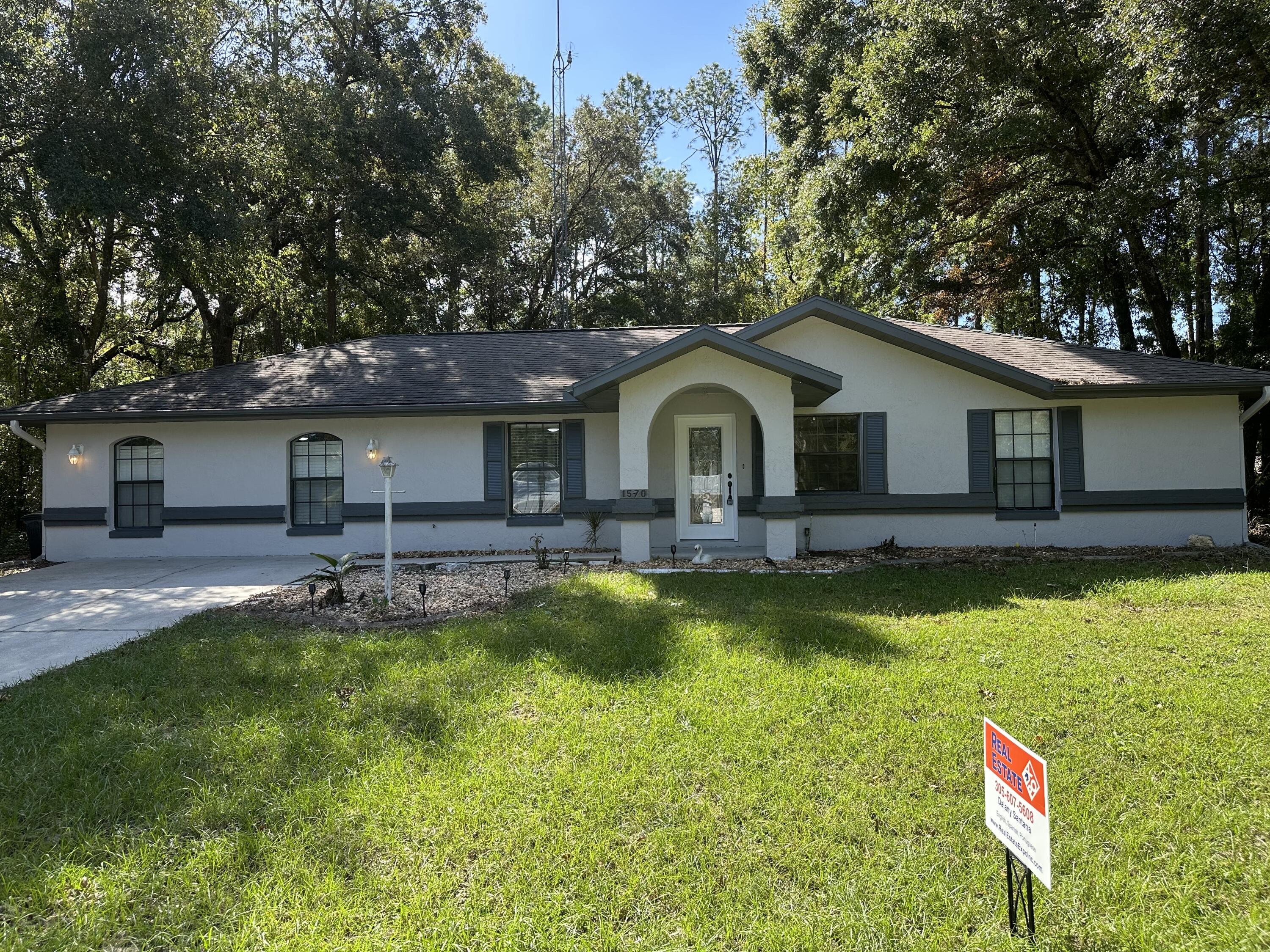 a front view of a house with swimming pool