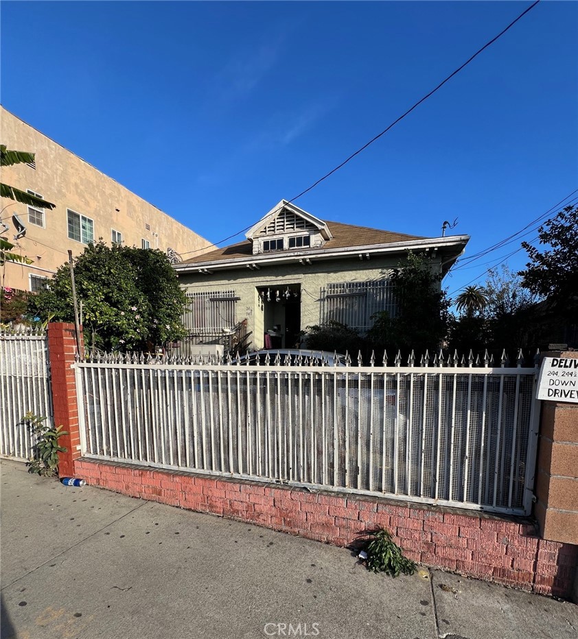 a view of a roof deck with wooden fence