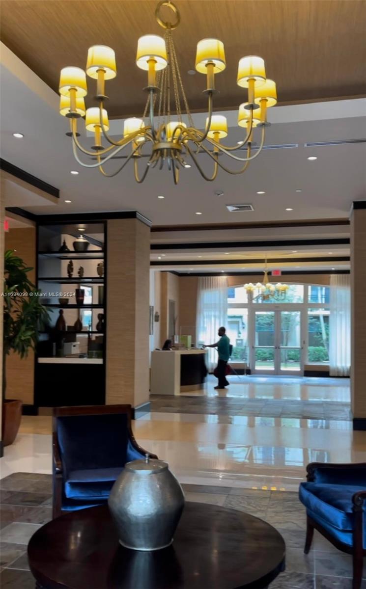 a view of dining room with furniture and chandelier