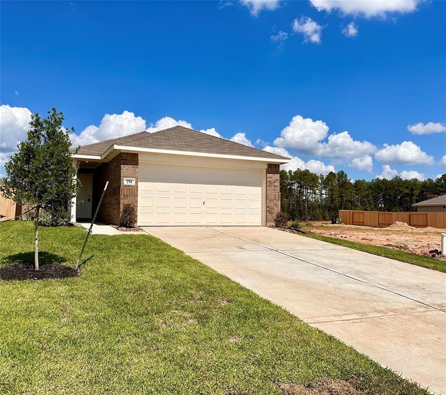 a front view of house with yard