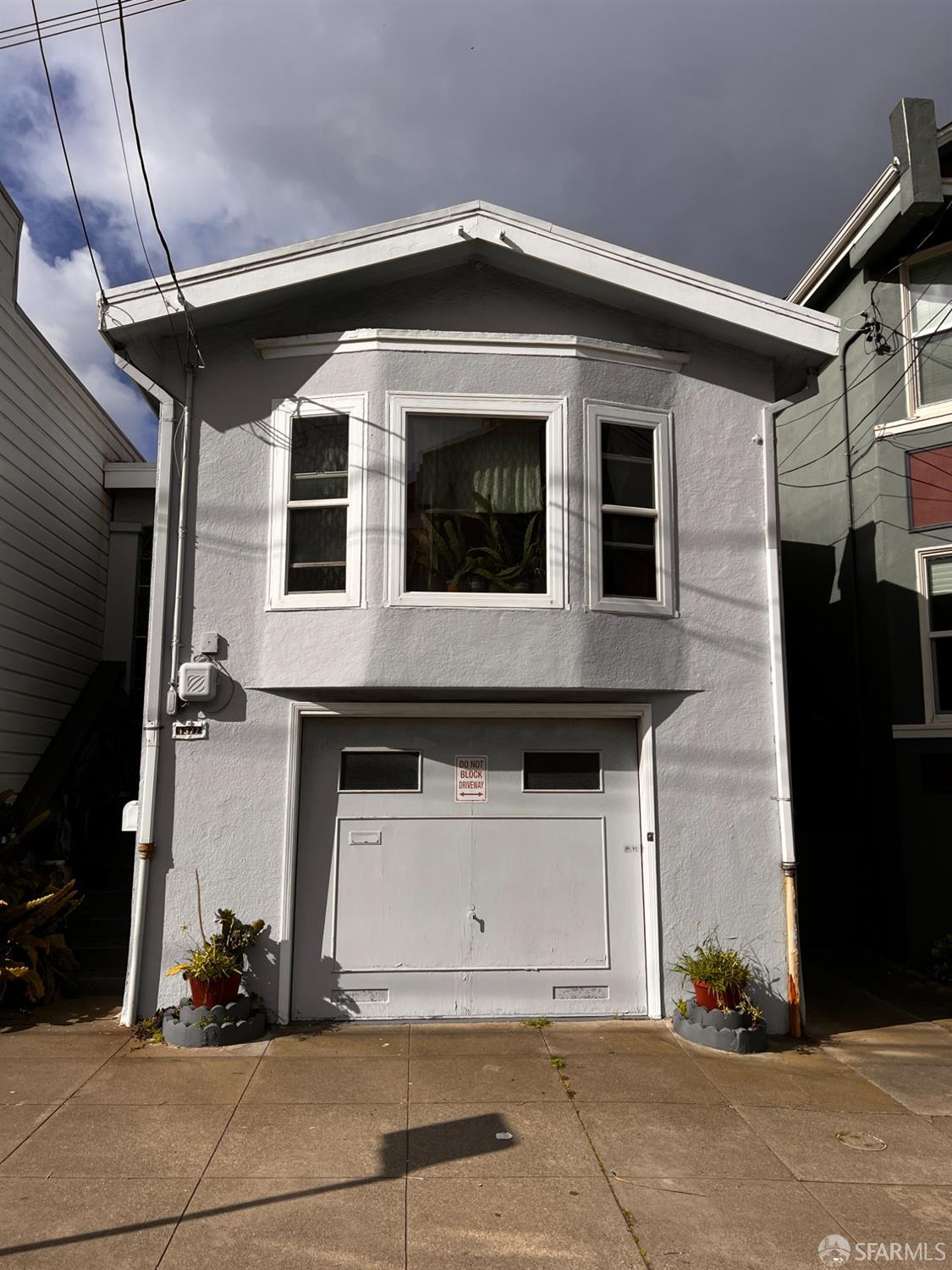 a front view of a house with garage