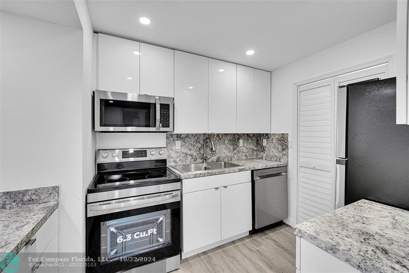 a kitchen with a stove and a microwave