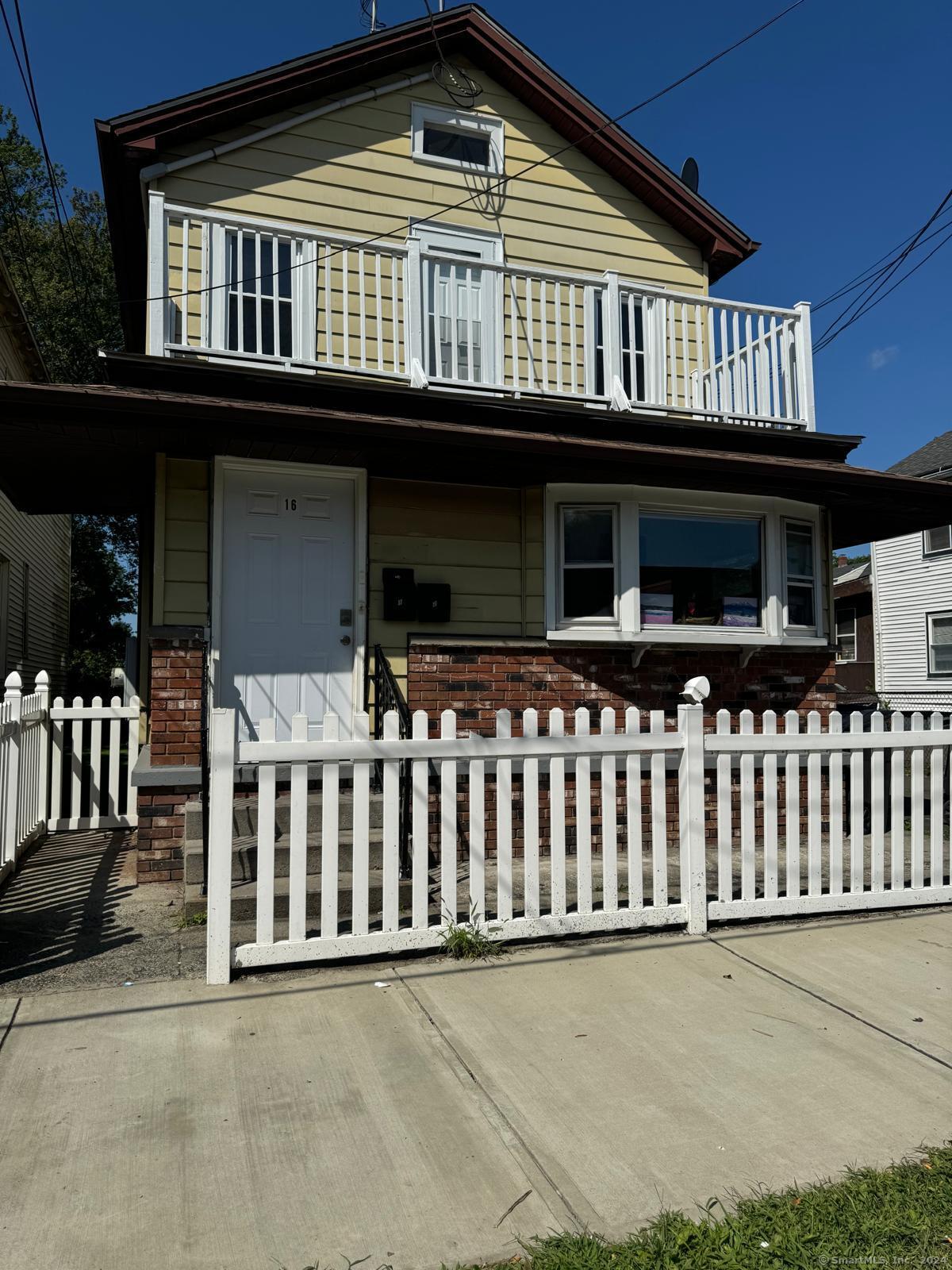 a front view of a house with balcony