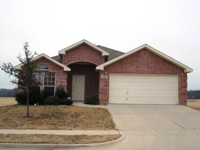 a front view of a house with garage