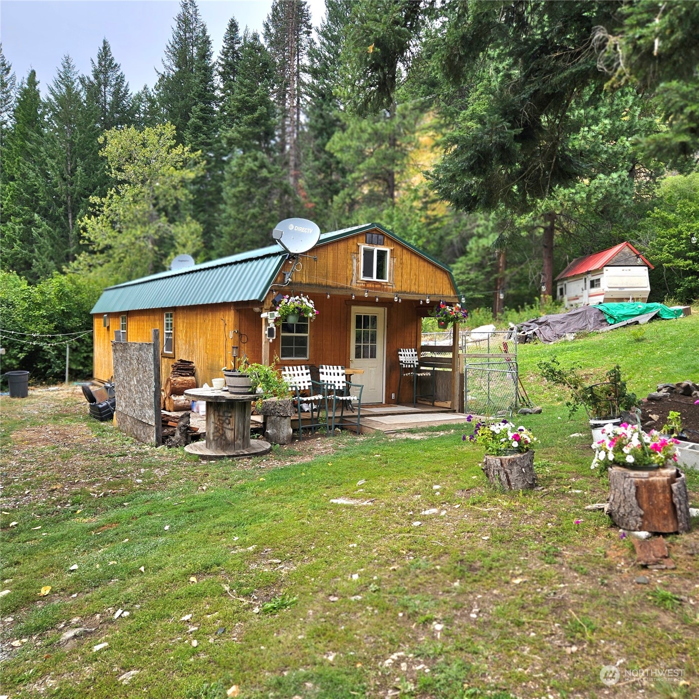 a view of a house with backyard porch and sitting area