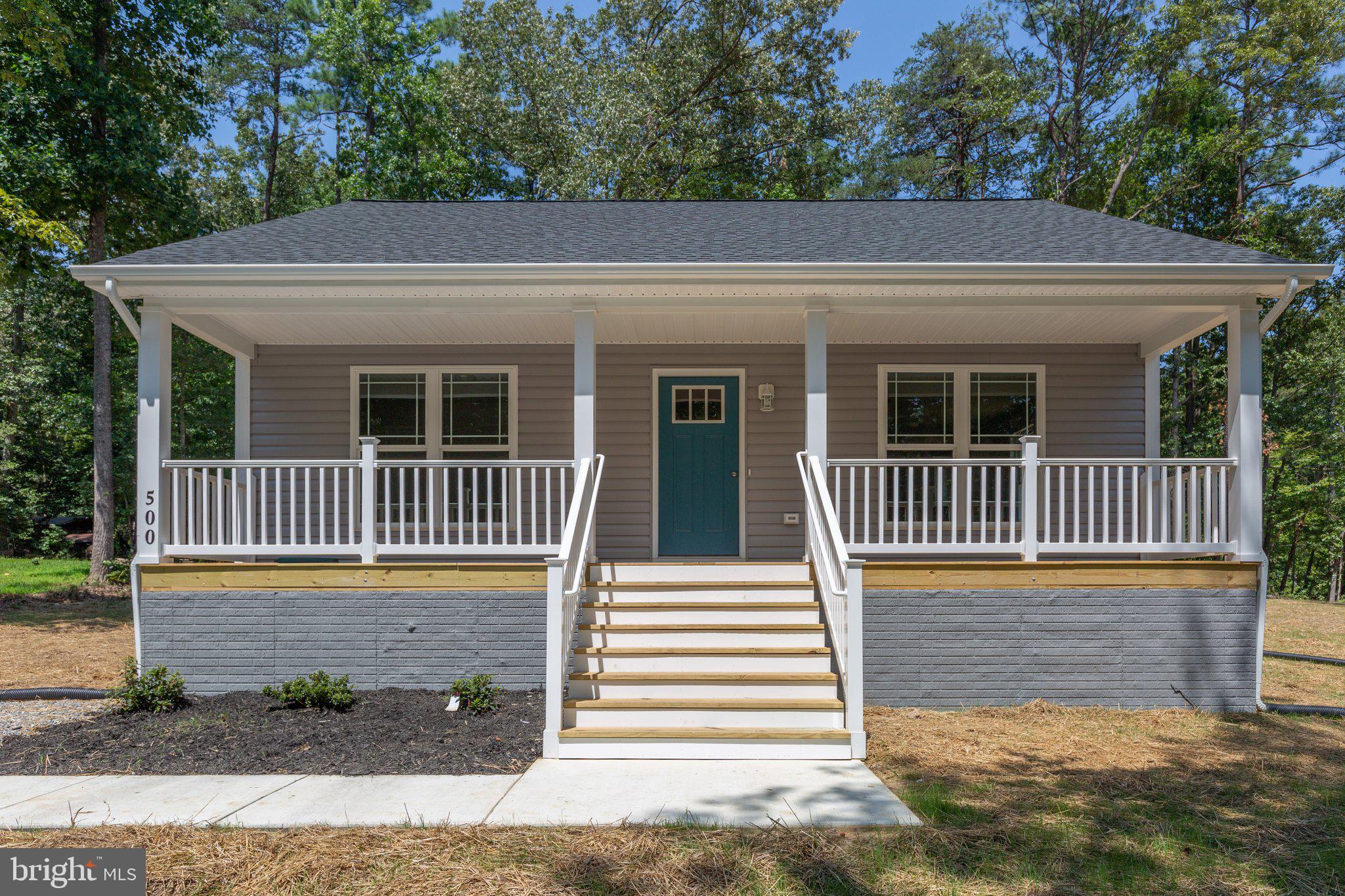 a view of a house with a small yard