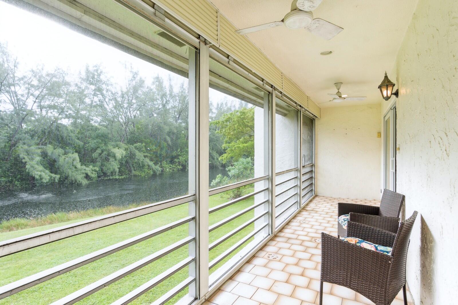 a view of a balcony with chairs