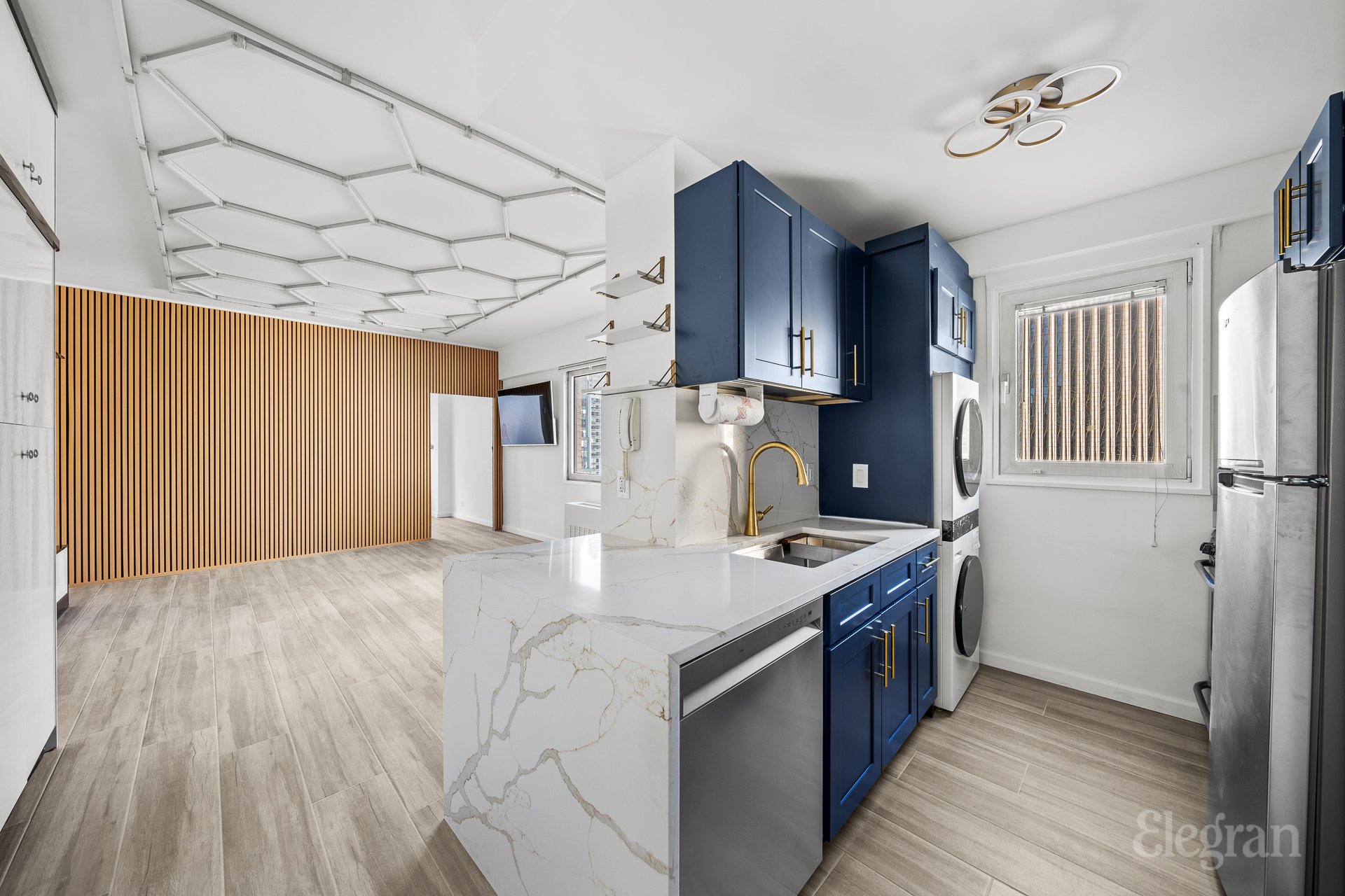 a kitchen with granite countertop a stove and a refrigerator