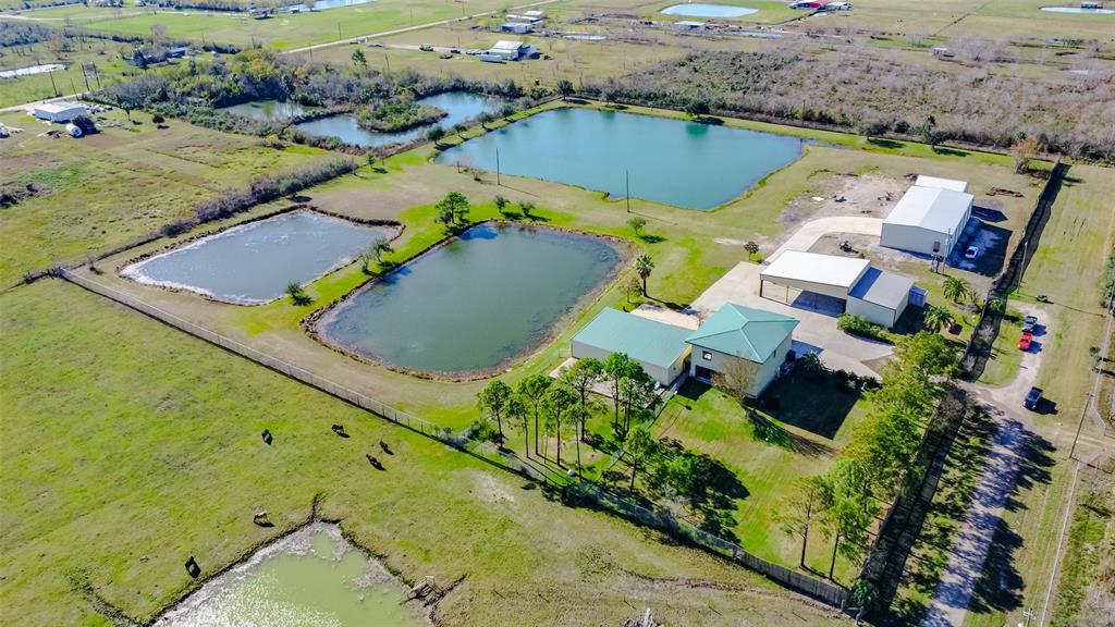 an aerial view of a house with a swimming pool