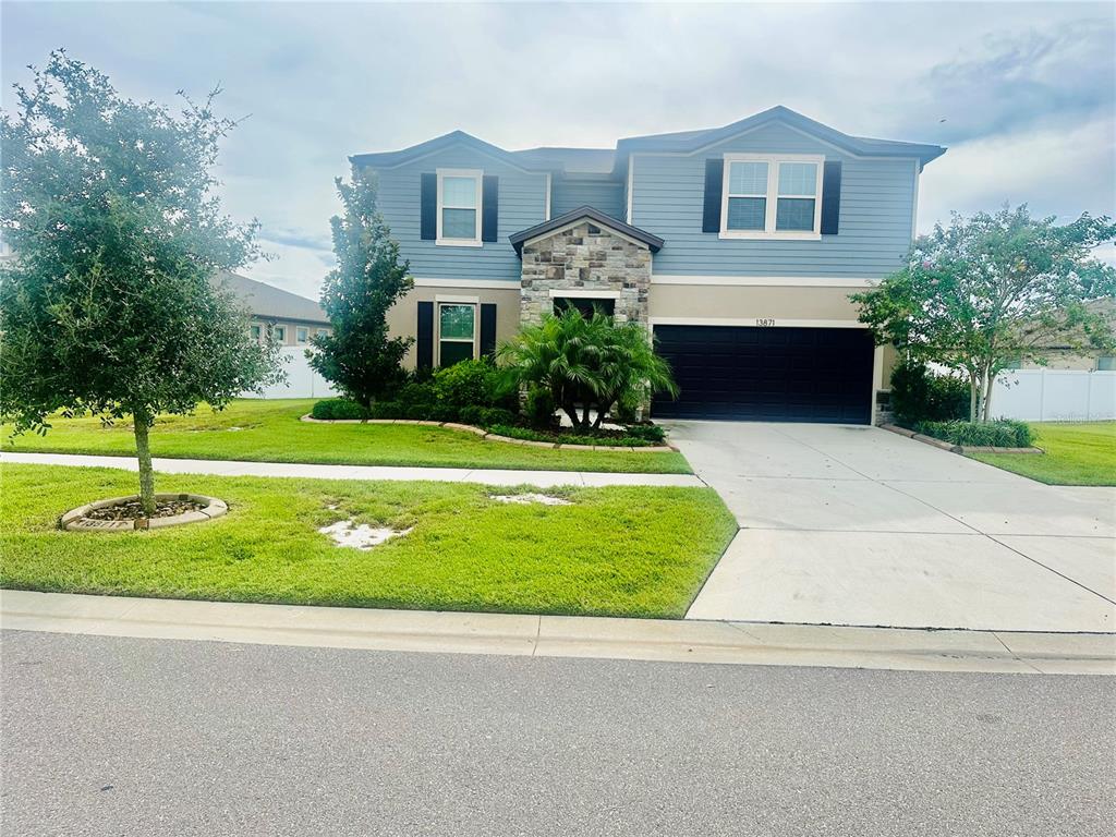 a front view of a house with a yard