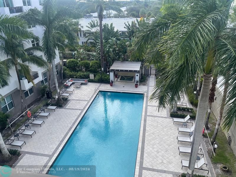 a view of a backyard with sitting area