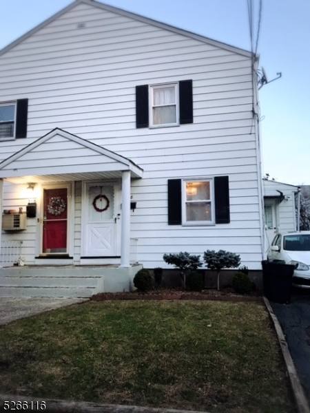 a view of house with backyard