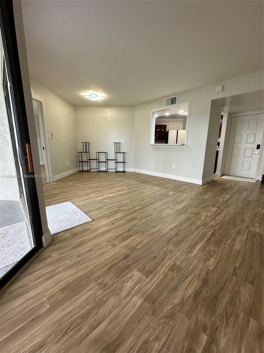 a view of a livingroom with wooden floor