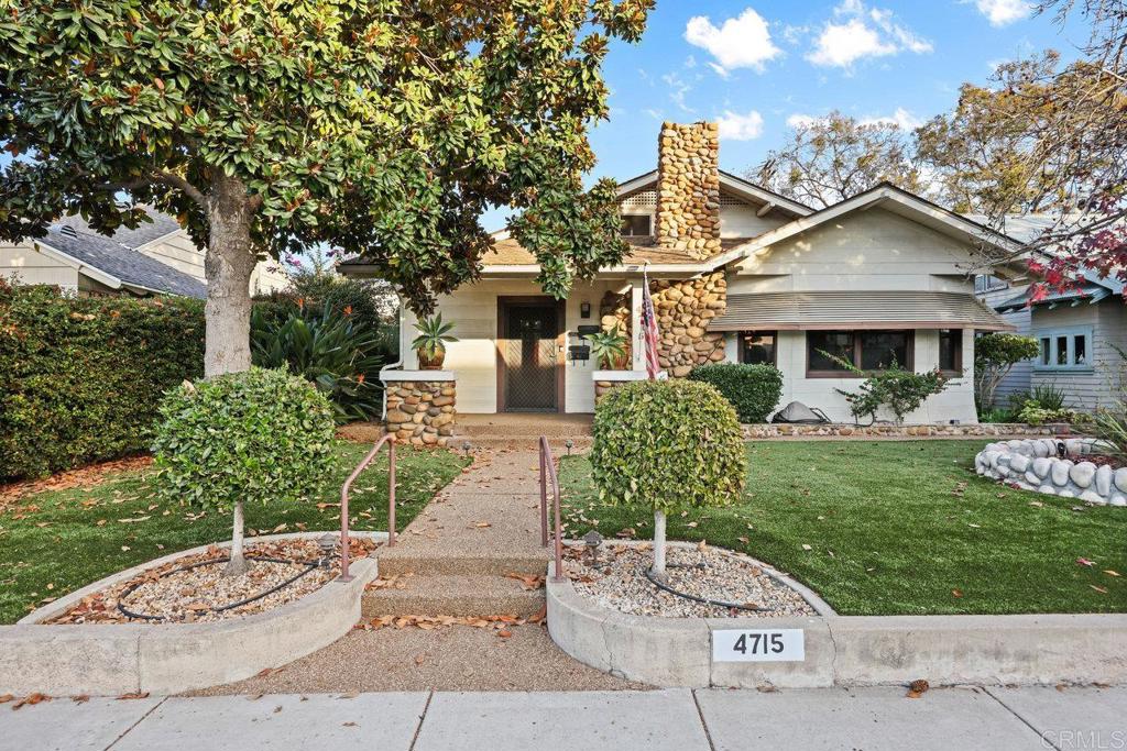 front view of a house with a yard