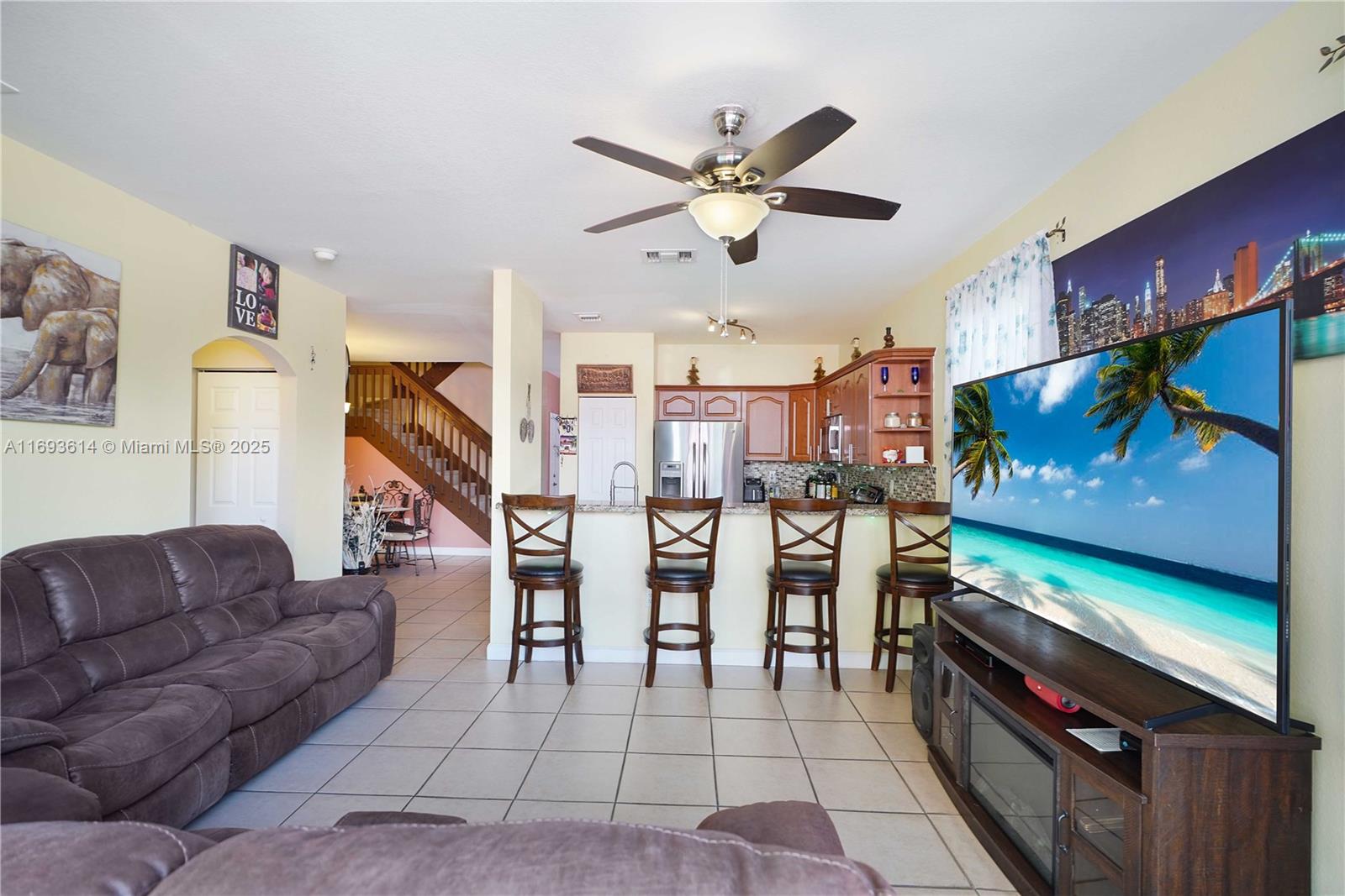 a living room with furniture and a flat screen tv