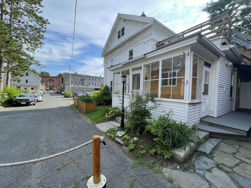 a view of a house with a street