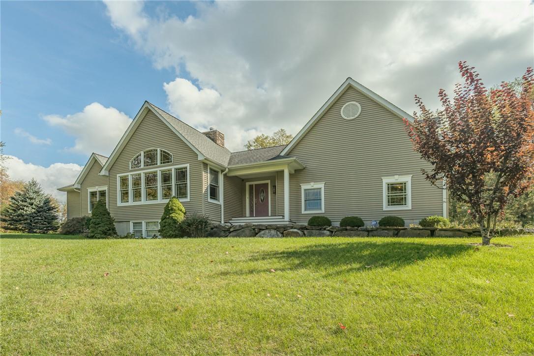 View of front of home featuring a front lawn