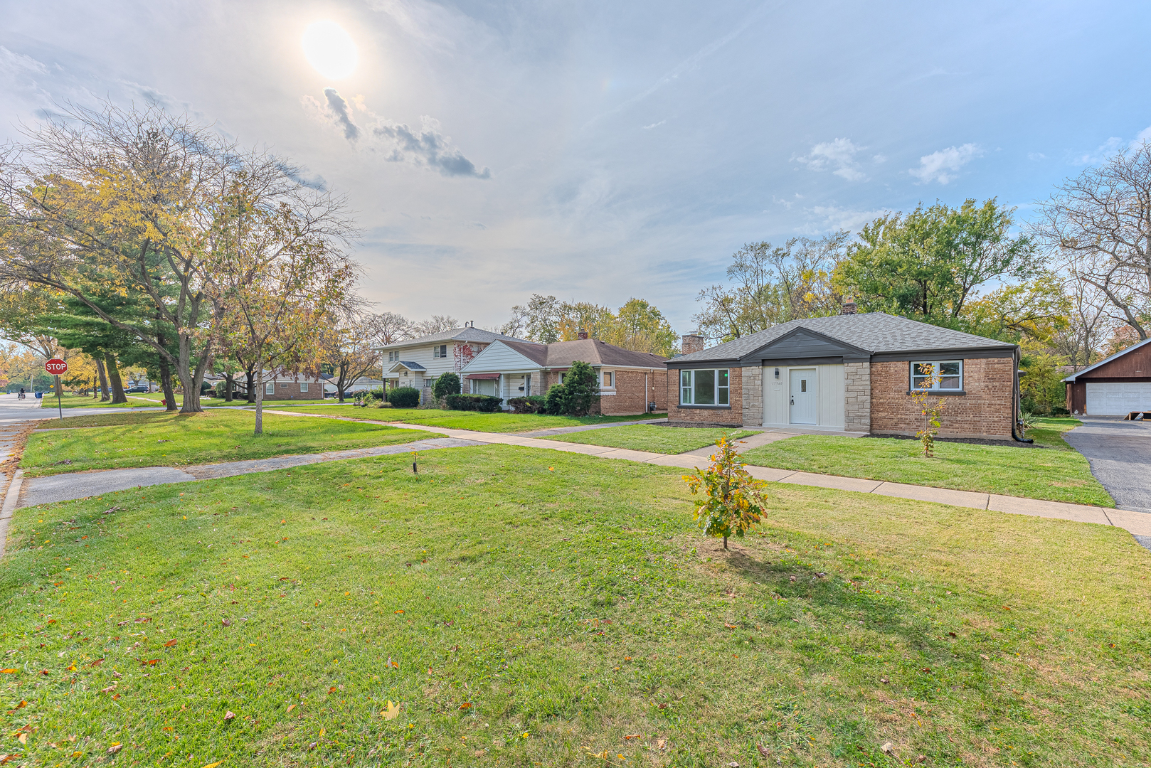 a front view of a house with a big yard