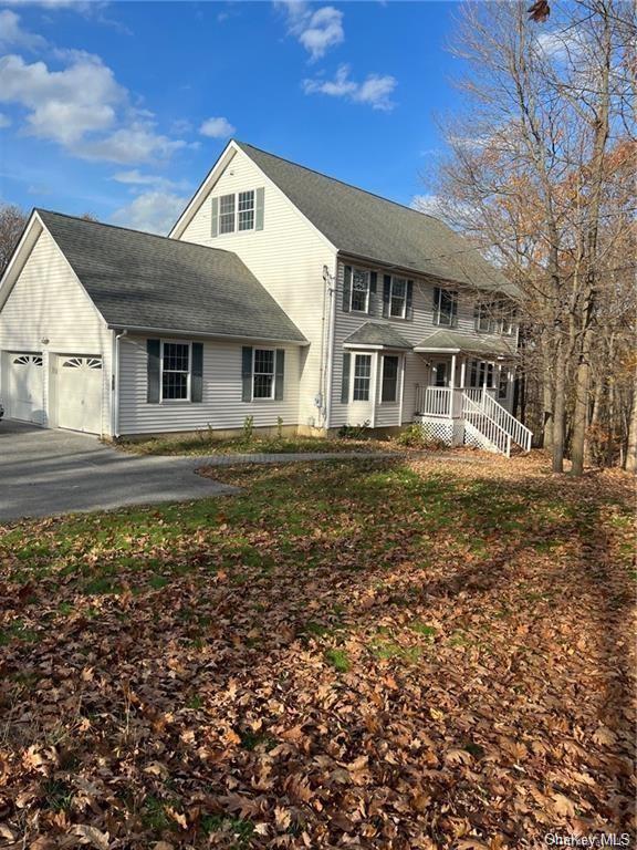 View of front of property featuring a garage