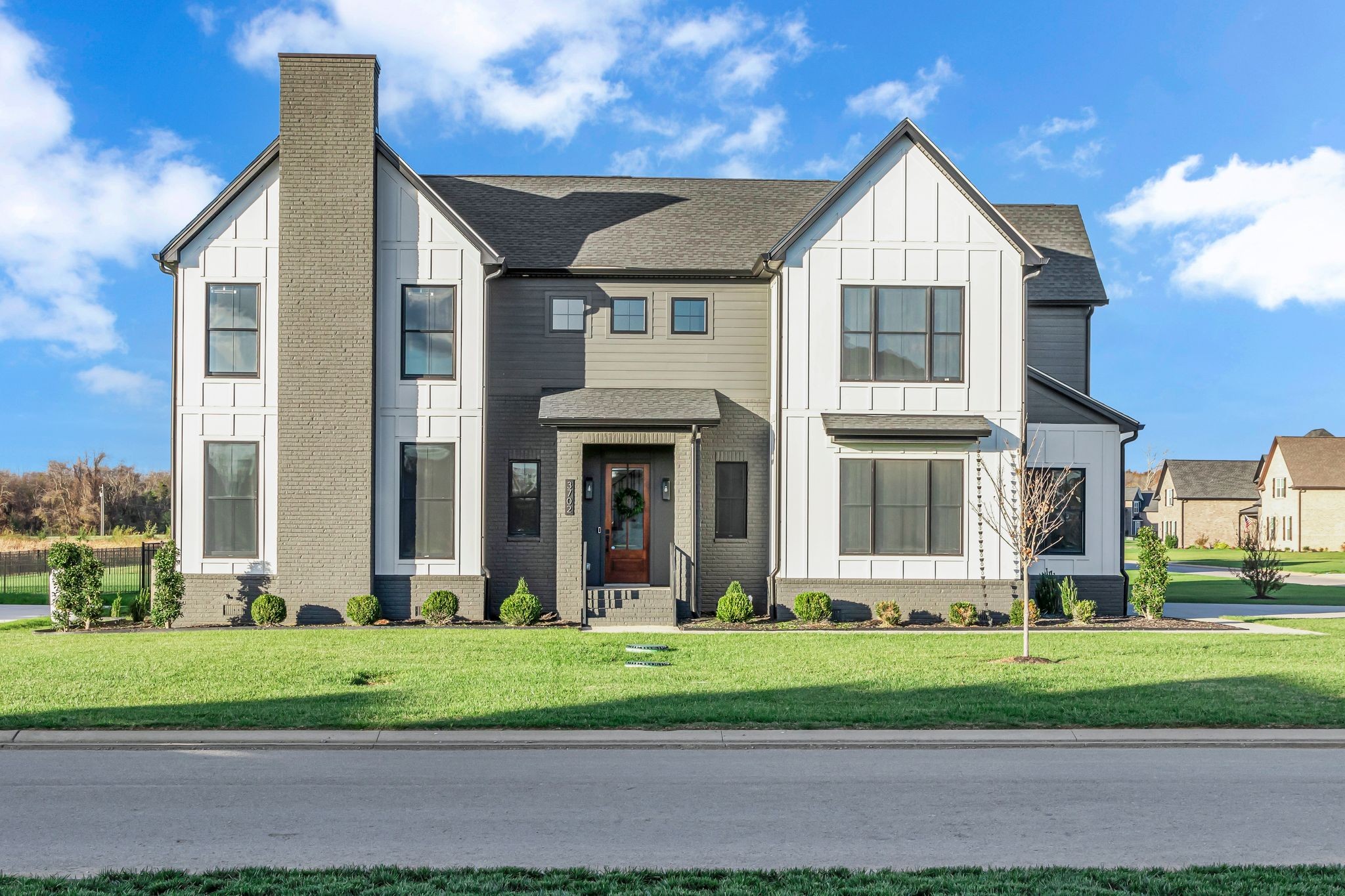 a front view of a house with a yard