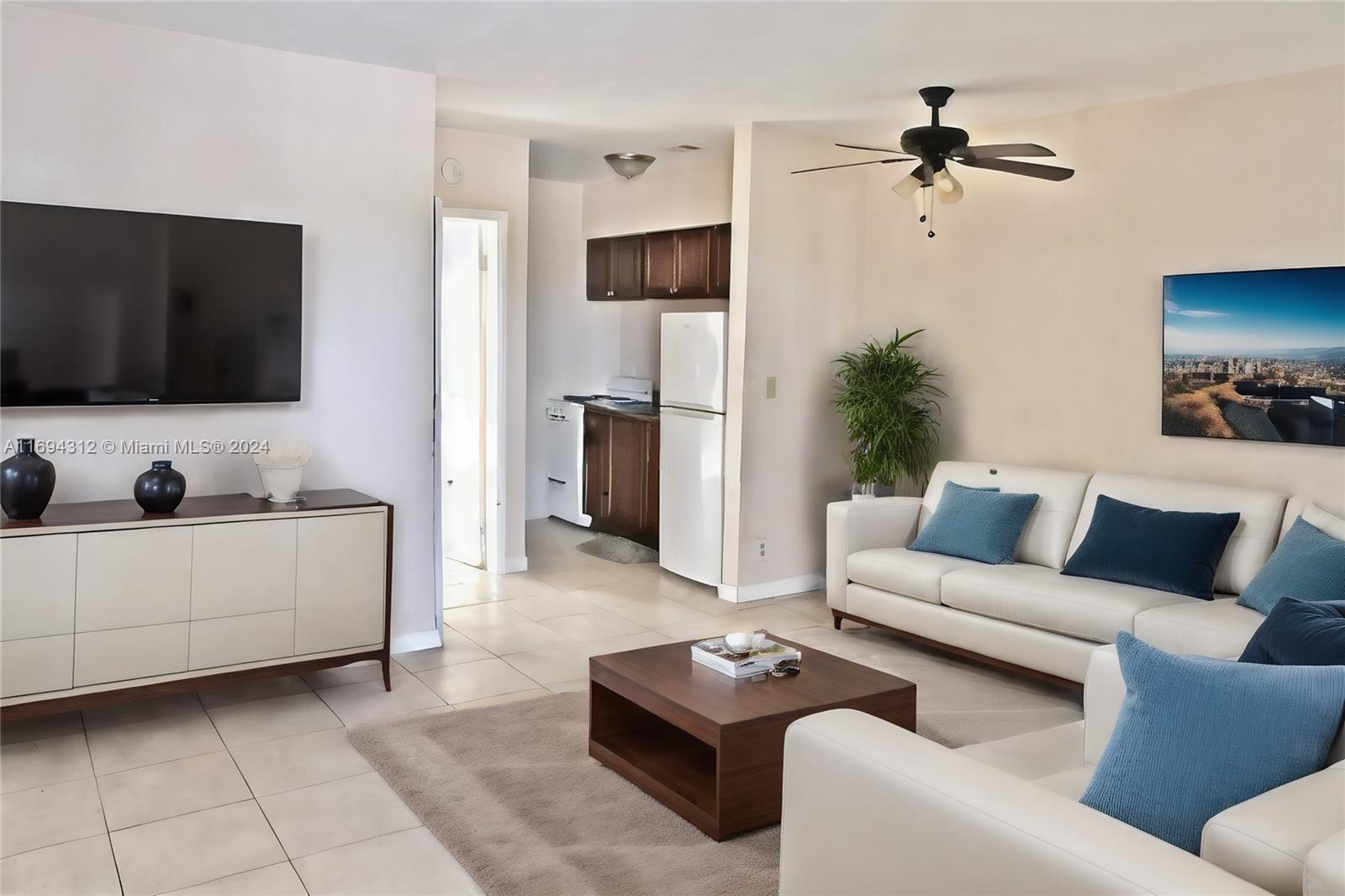 a living room with furniture and a flat screen tv