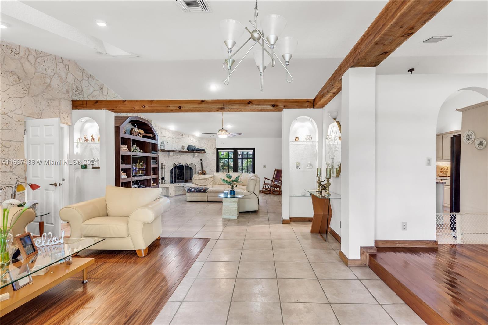 a living room with furniture and white walls