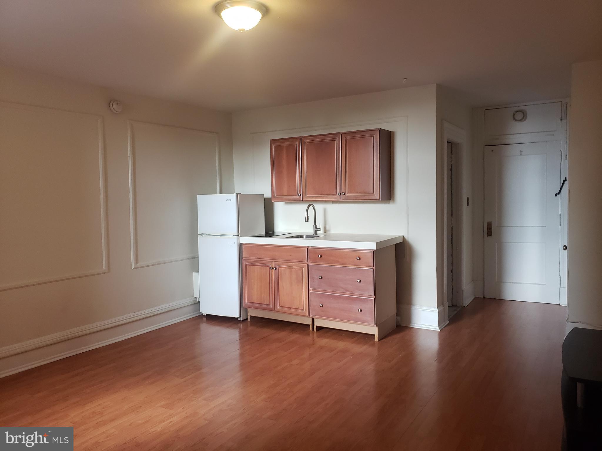 a room with furniture and wooden floor