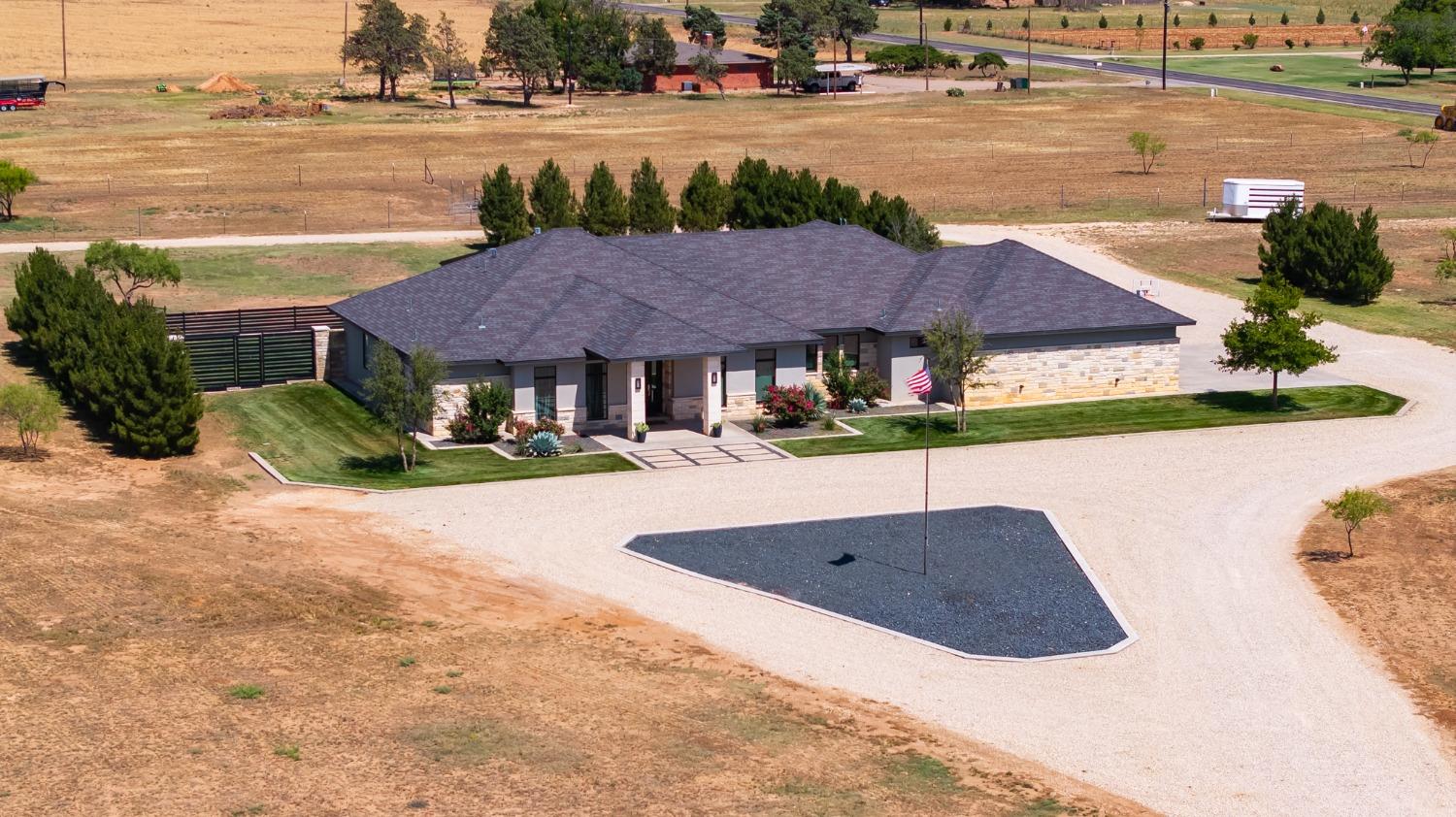 a house with view of the ocean and a big yard