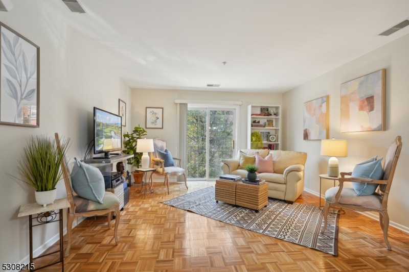 a living room with furniture or couch and a potted plant