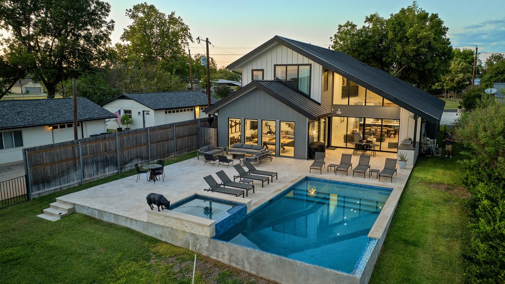 a front view of house with yard outdoor seating and green space