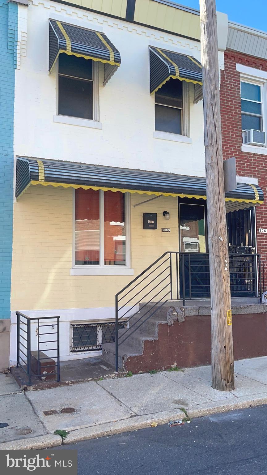 a view of a house with a door and a balcony