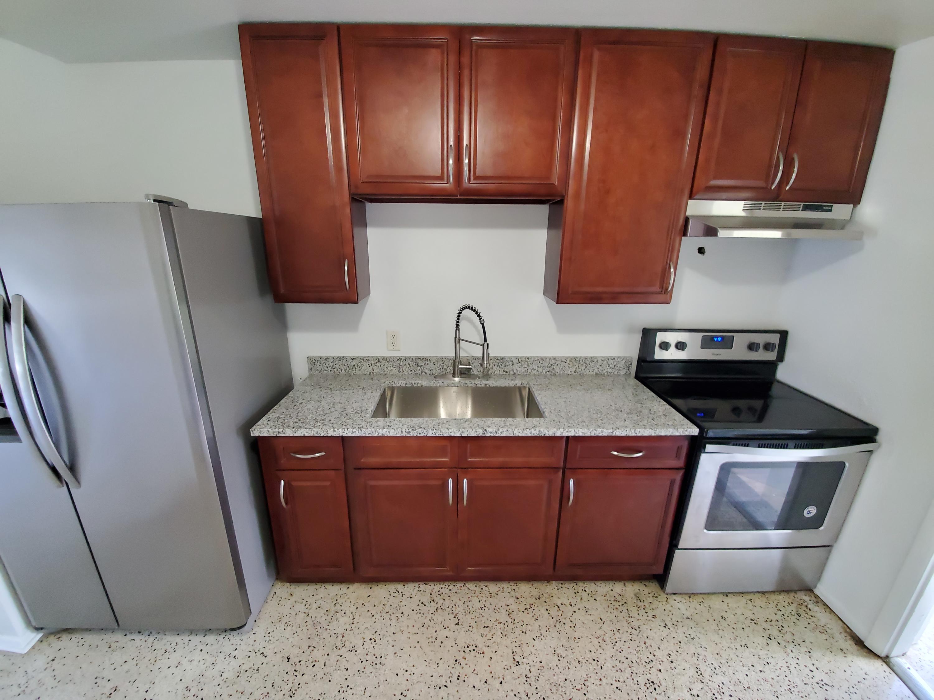 a kitchen with a sink and cabinets