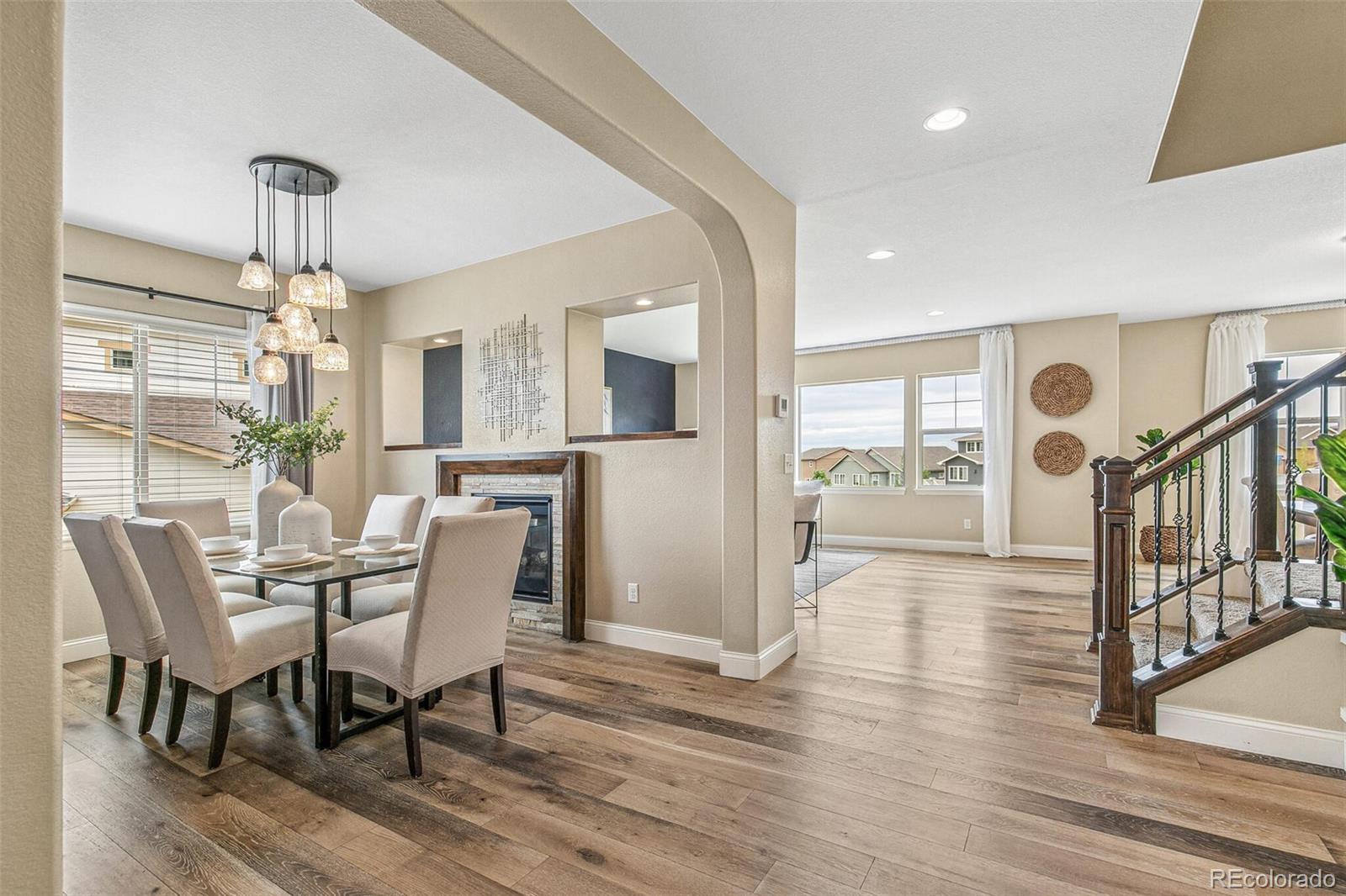 a view of a dining room with furniture window and wooden floor