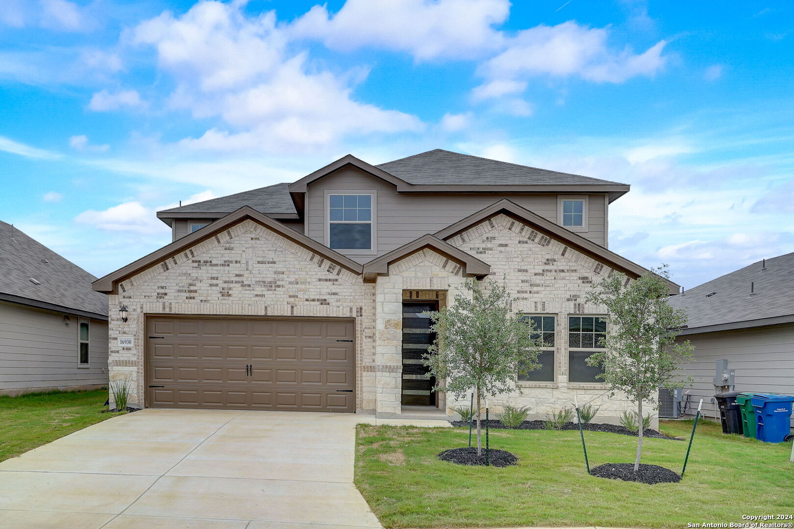 a front view of a house with a yard