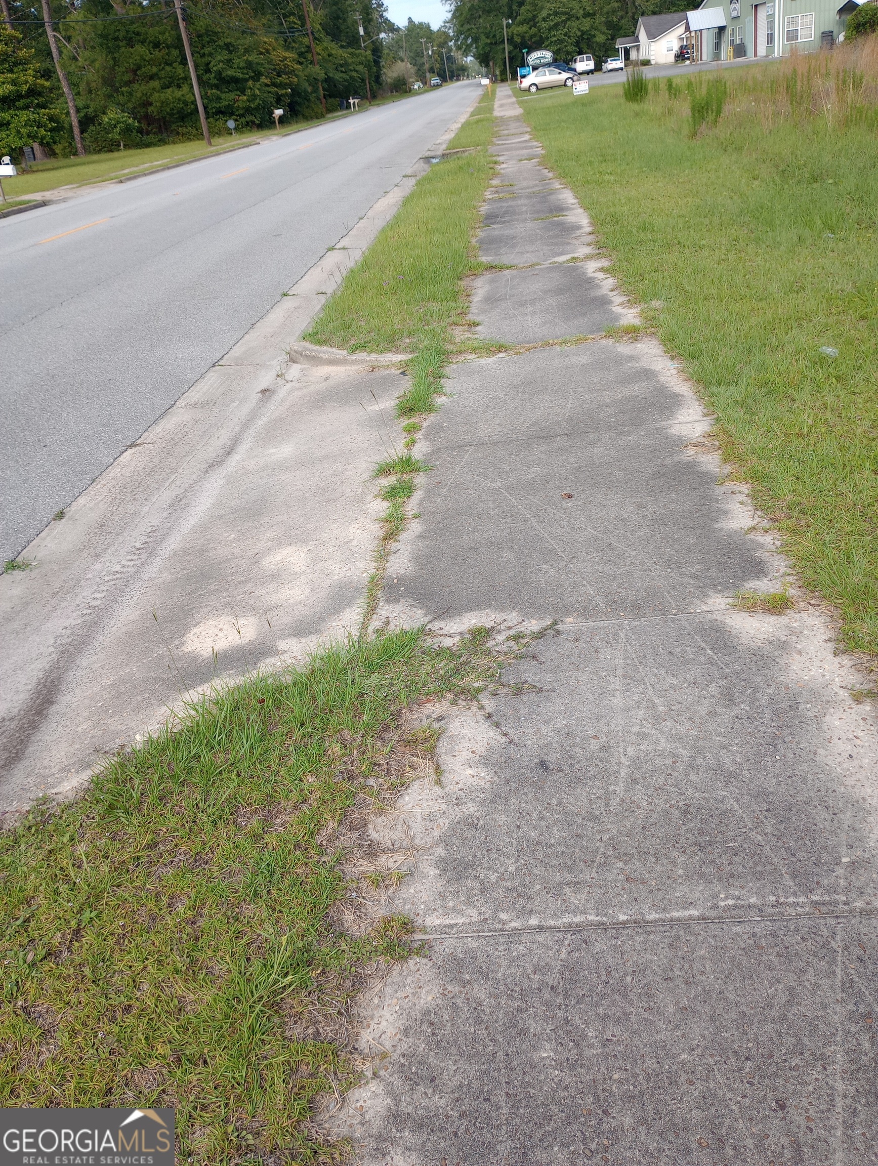 a view of a road with a yard