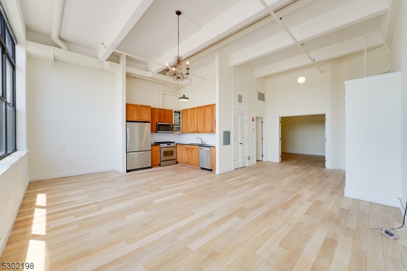 a view of a kitchen with a sink and a window