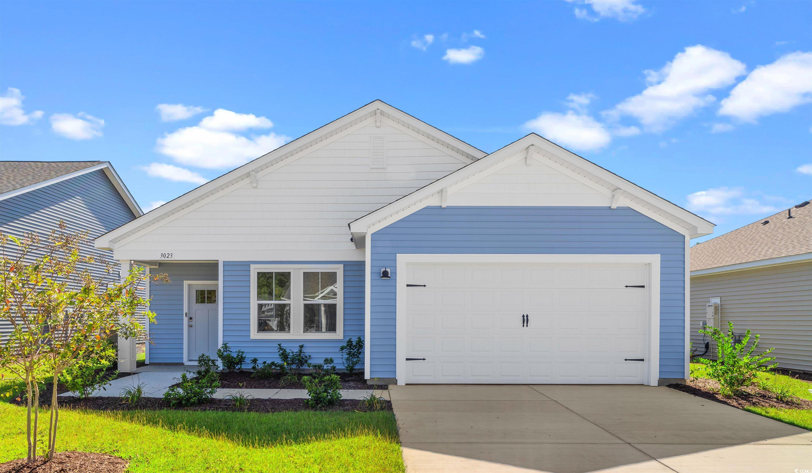 View of front of home featuring a garage