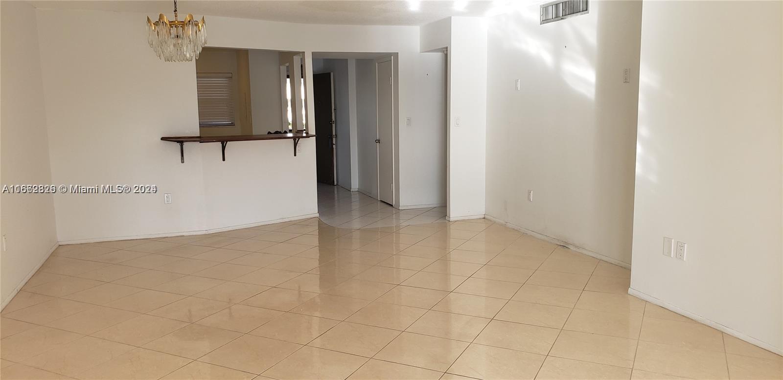 a view of a kitchen with an empty space