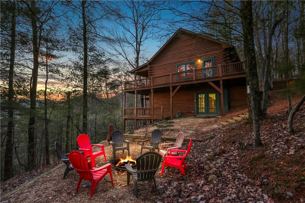 a backyard of a house with table and chairs