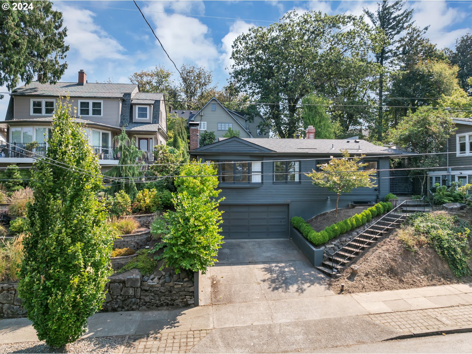 a front view of a house with garden